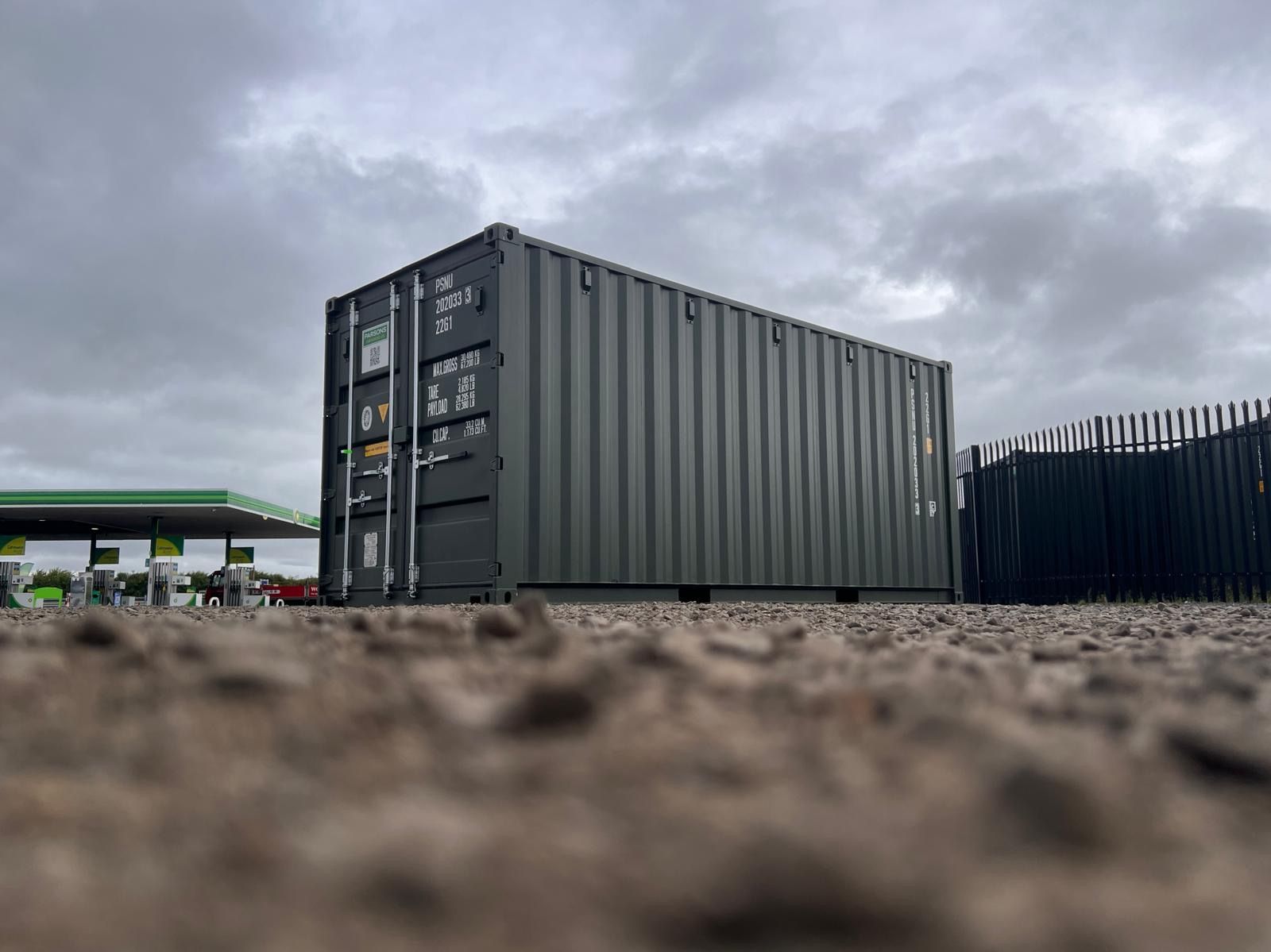 A new green shipping container on the depot yard